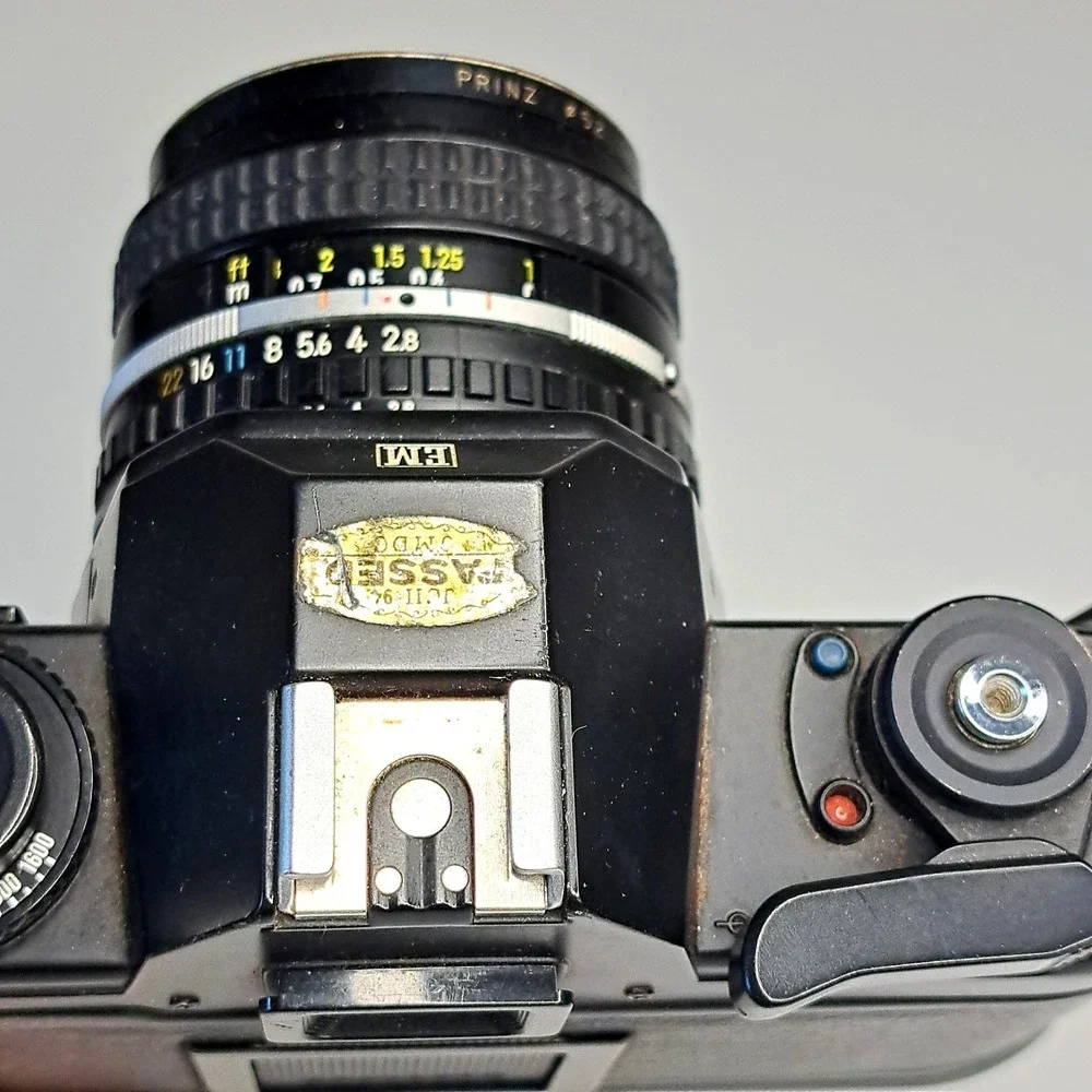 Vintage Nikon EM Black SLR Film Camera + Nikon Lens + Flash + Film + Manuals